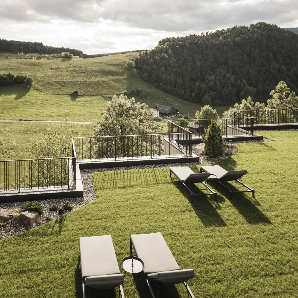 Sun loungers on the garden terrace at the Alpenflora overlooking the Alpe di Siusi