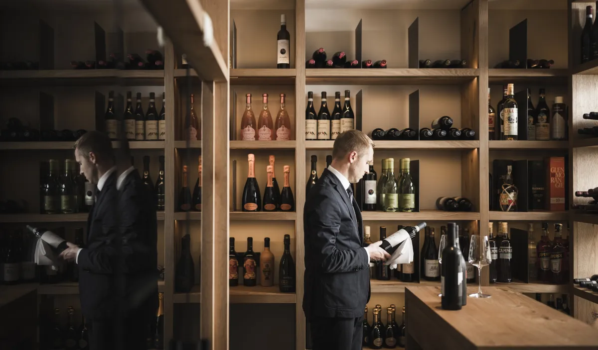 Sommeliers selecting bottles from the well-stocked wine cellar at the Alpenflora