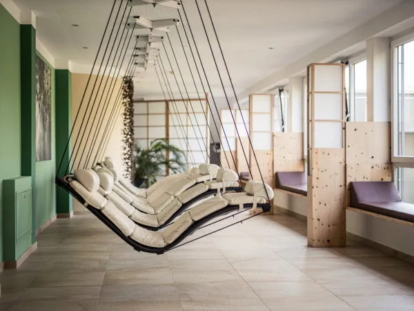 Relaxation room at the Alpenflora with hanging swing loungers for unwinding